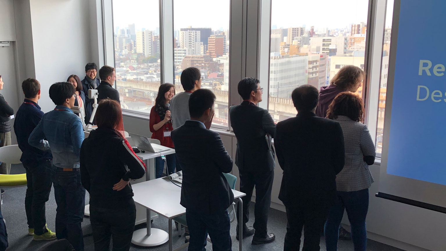 Students preparing for a presentation in a high rise in Tokyo.
