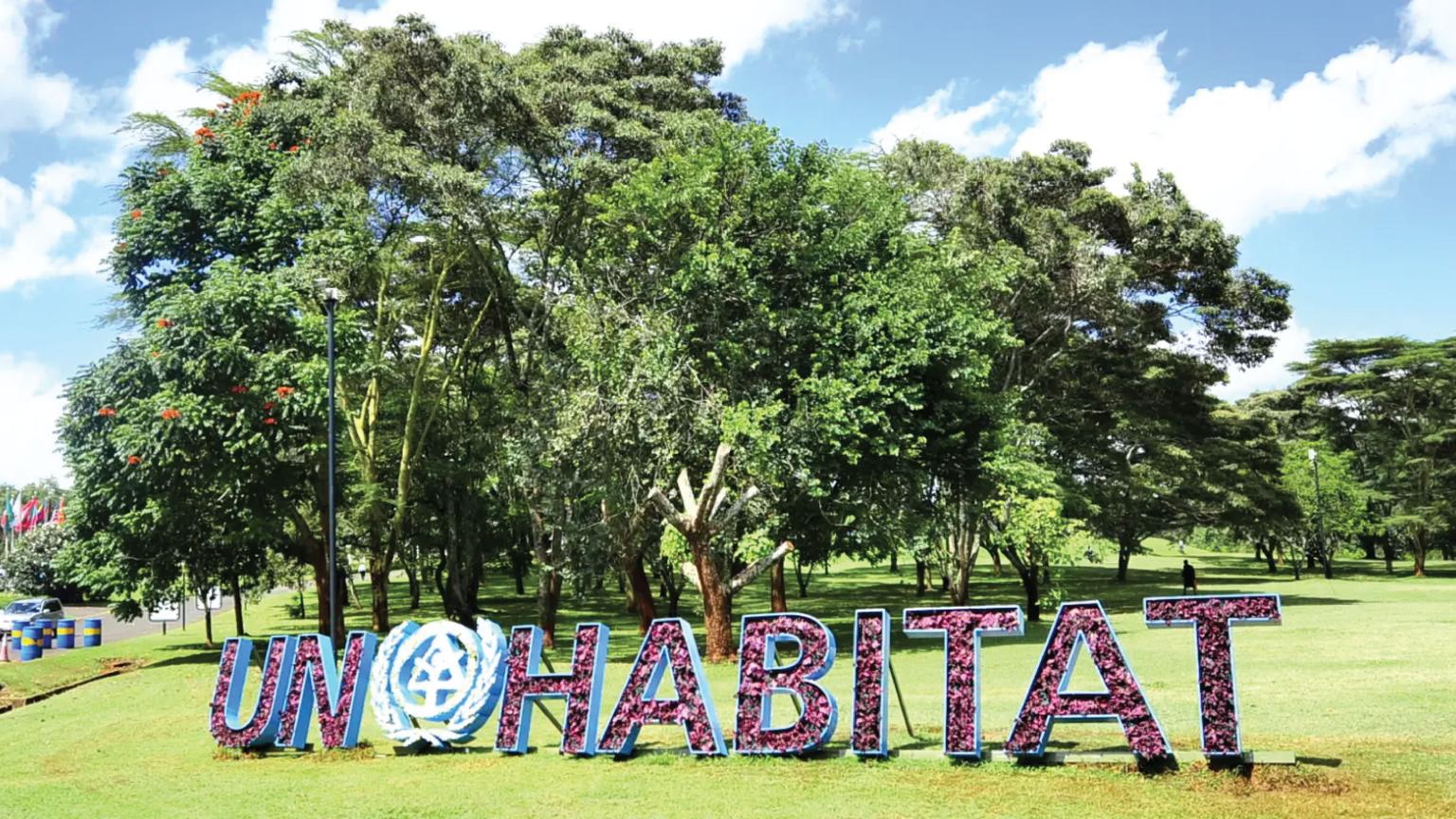 Image of UN Habitat logo model in a grass field