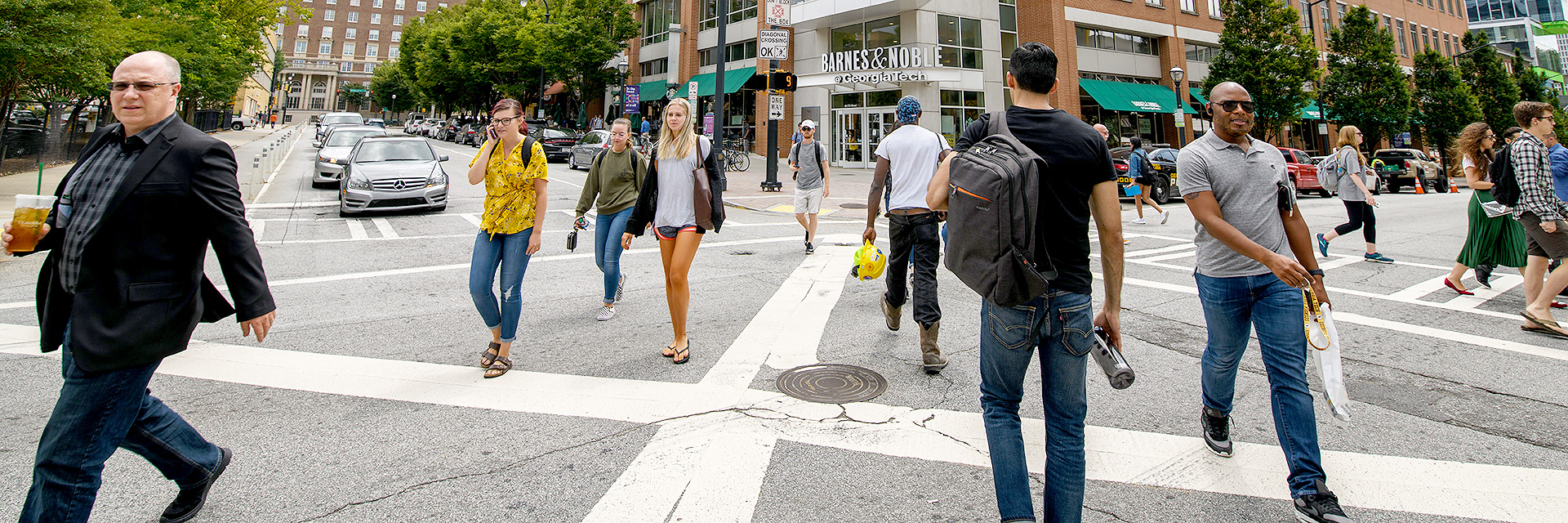 People walking in a crosswalk in Tech Square.