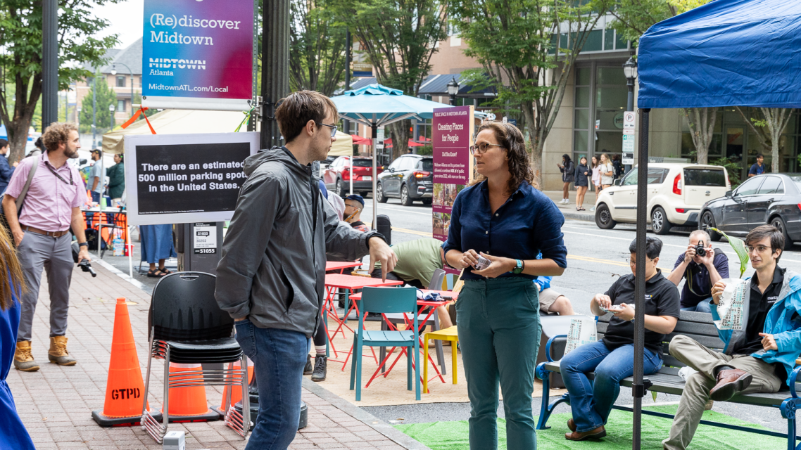 Students speaking at Park(ing) Day.